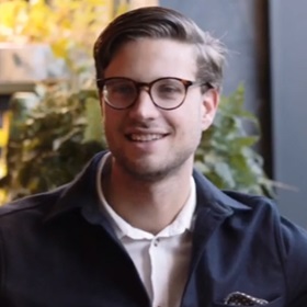 Person smiling in a casual professional setting